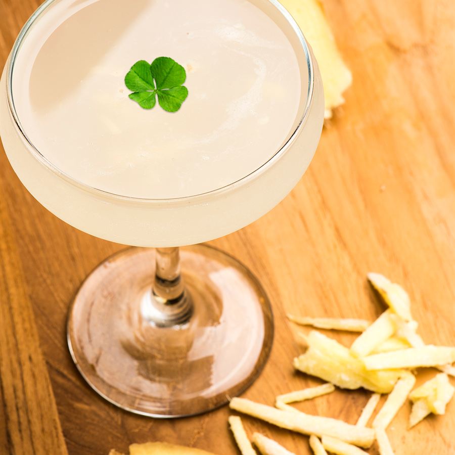 Cocktail with four-leaf clover